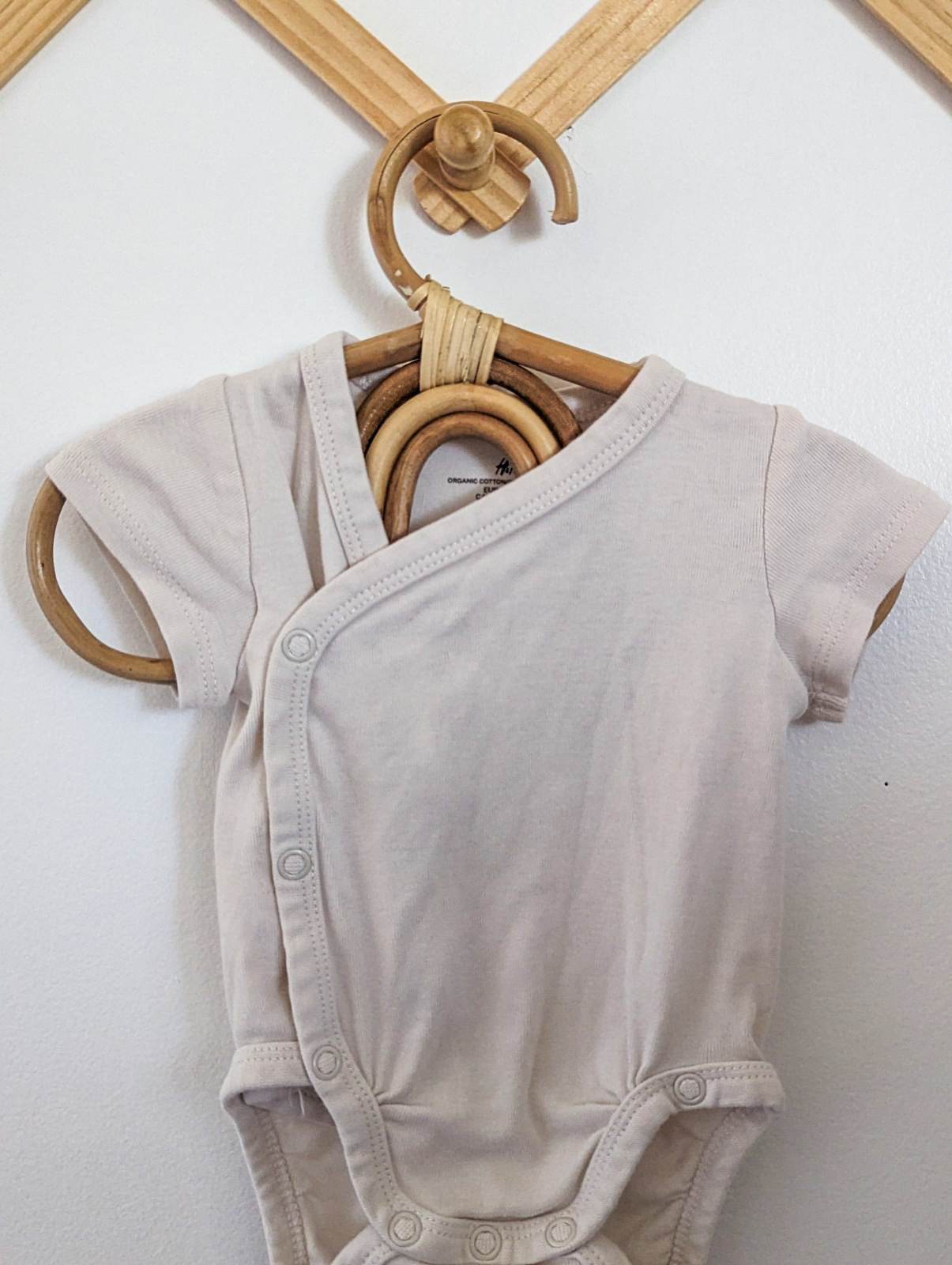 H&M Organic Cotton Wrap Bodysuit in Cream (NB)