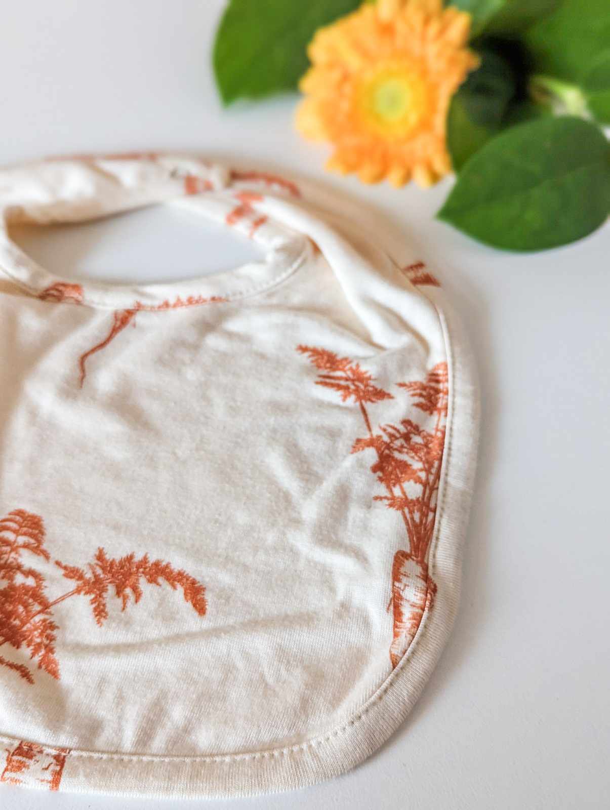 Kate Quinn Bamboo Bib in Carrot (small)