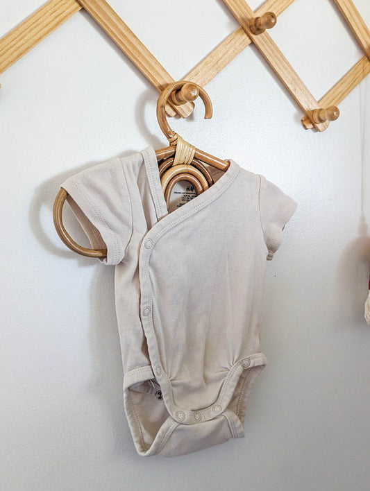 H&M Organic Cotton Wrap Bodysuit in Cream (NB)