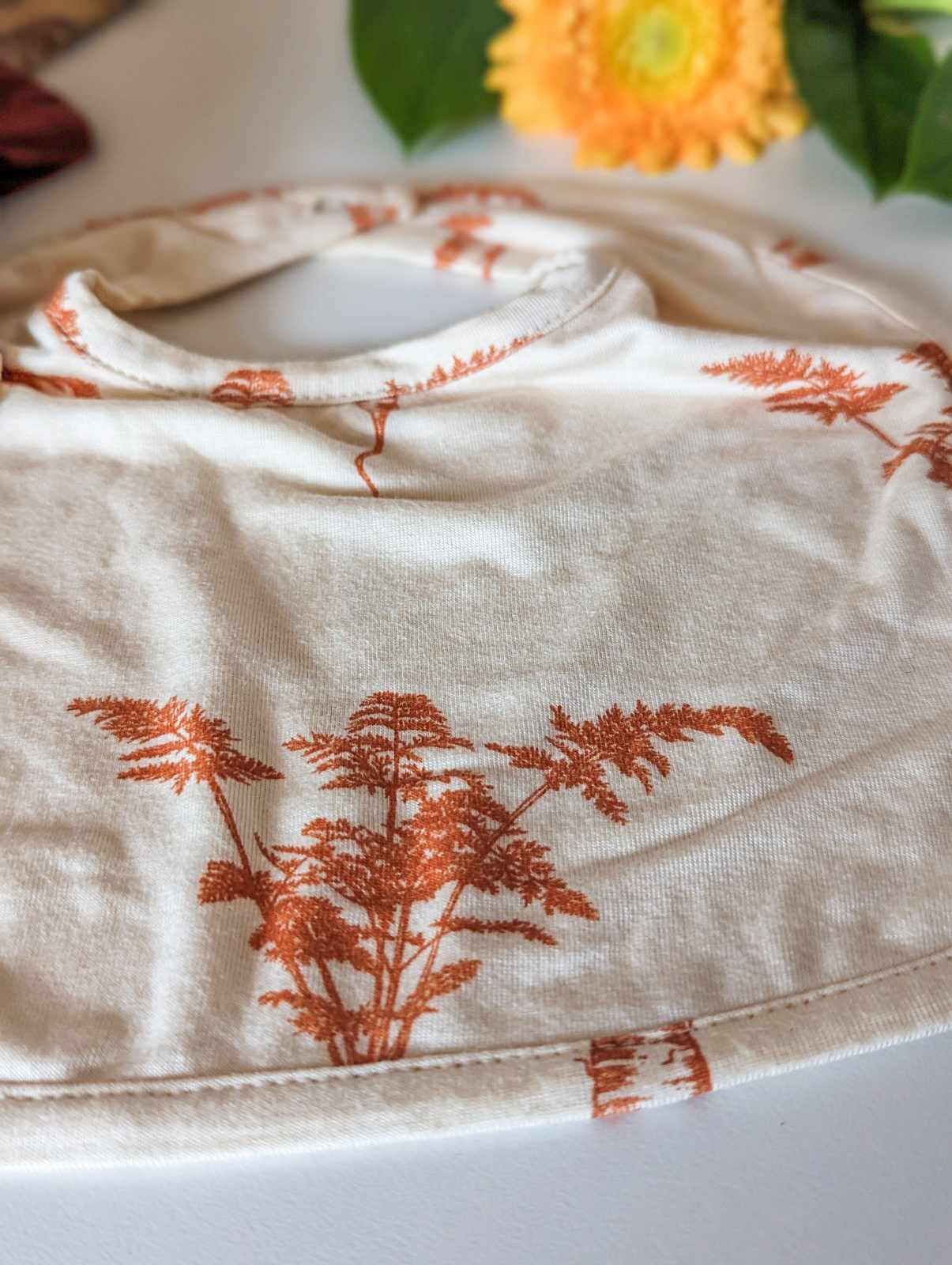 Kate Quinn Bamboo Bib in Carrot (small)