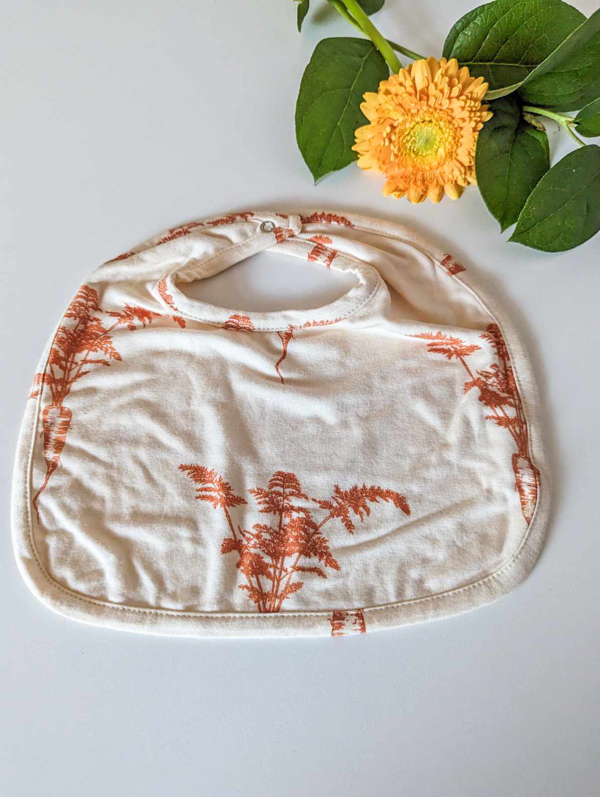 Kate Quinn Bamboo Bib in Carrot (small)